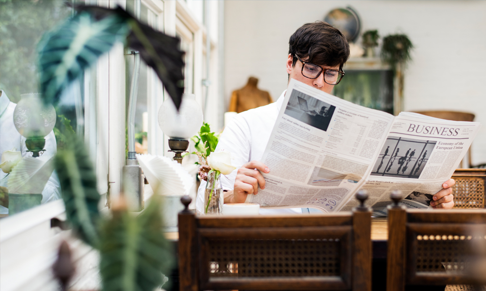 man reading financial guides